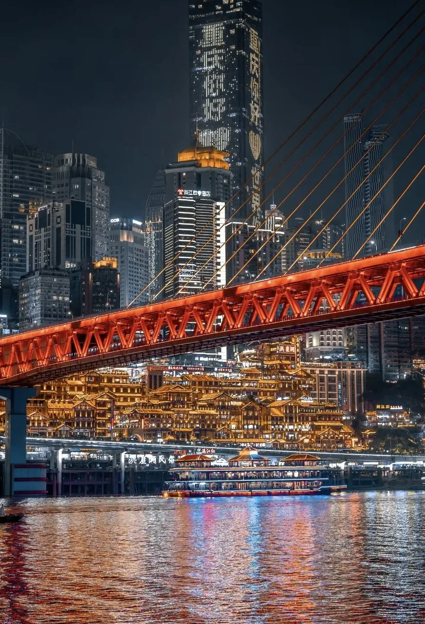 Qiansimen Bridge and Hongya Cave lit up at night in Chongqing