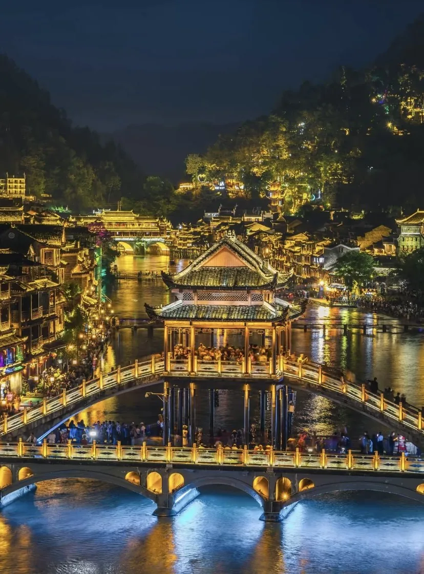 Fenghuang Ancient Town riverside and bridges lit up at night