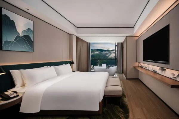 King room with floor-to-ceiling mountain view at Hilton Garden Inn Zhangjiajie