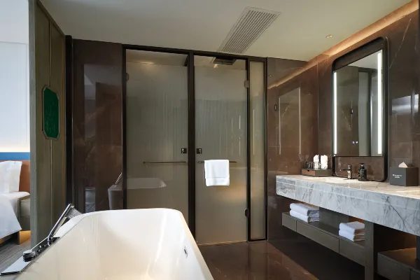 Marble bathroom with freestanding tub at Wyndham Garden Zhangjiajie