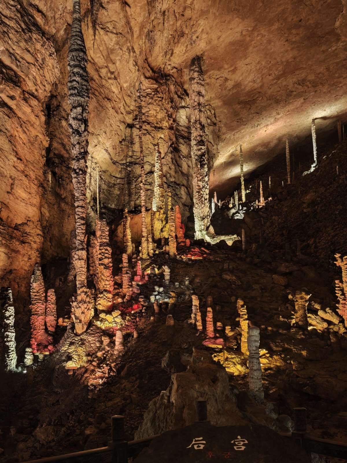 The rear hall of the Dragon Palace in Huanglong Cave, Zhangjiajie, with hundreds of stalagmites rising from the cave floor