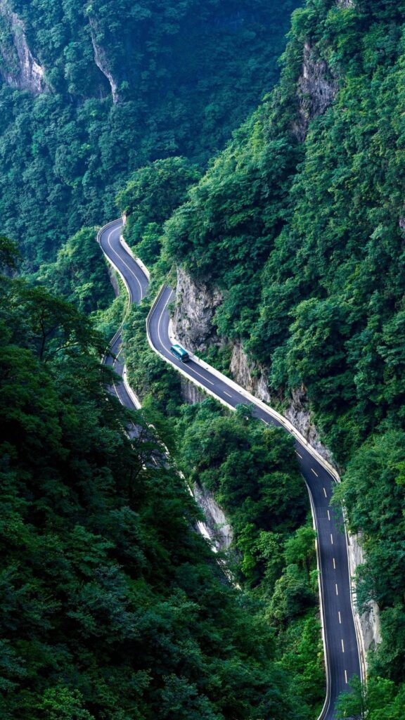 The 99-bend road curving through forest on Tianmen Mountain, seen from above