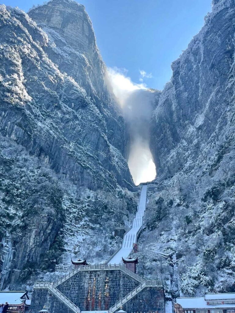 Tianmen Cave and the Stairway to Heaven under fresh snow on Tianmen Mountain, Zhangjiajie, in winter