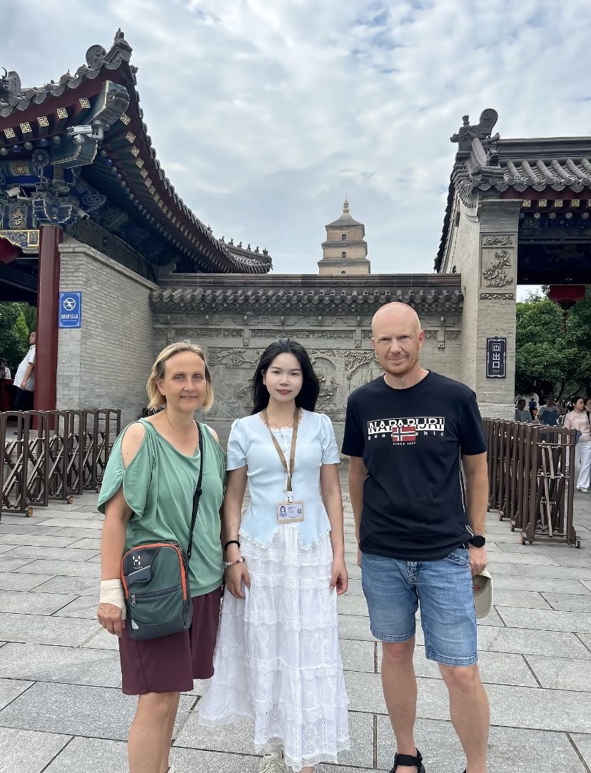 Local guide with an overseas couple at Big Wild Goose Pagoda in Xi'an on a multi-city private China tour