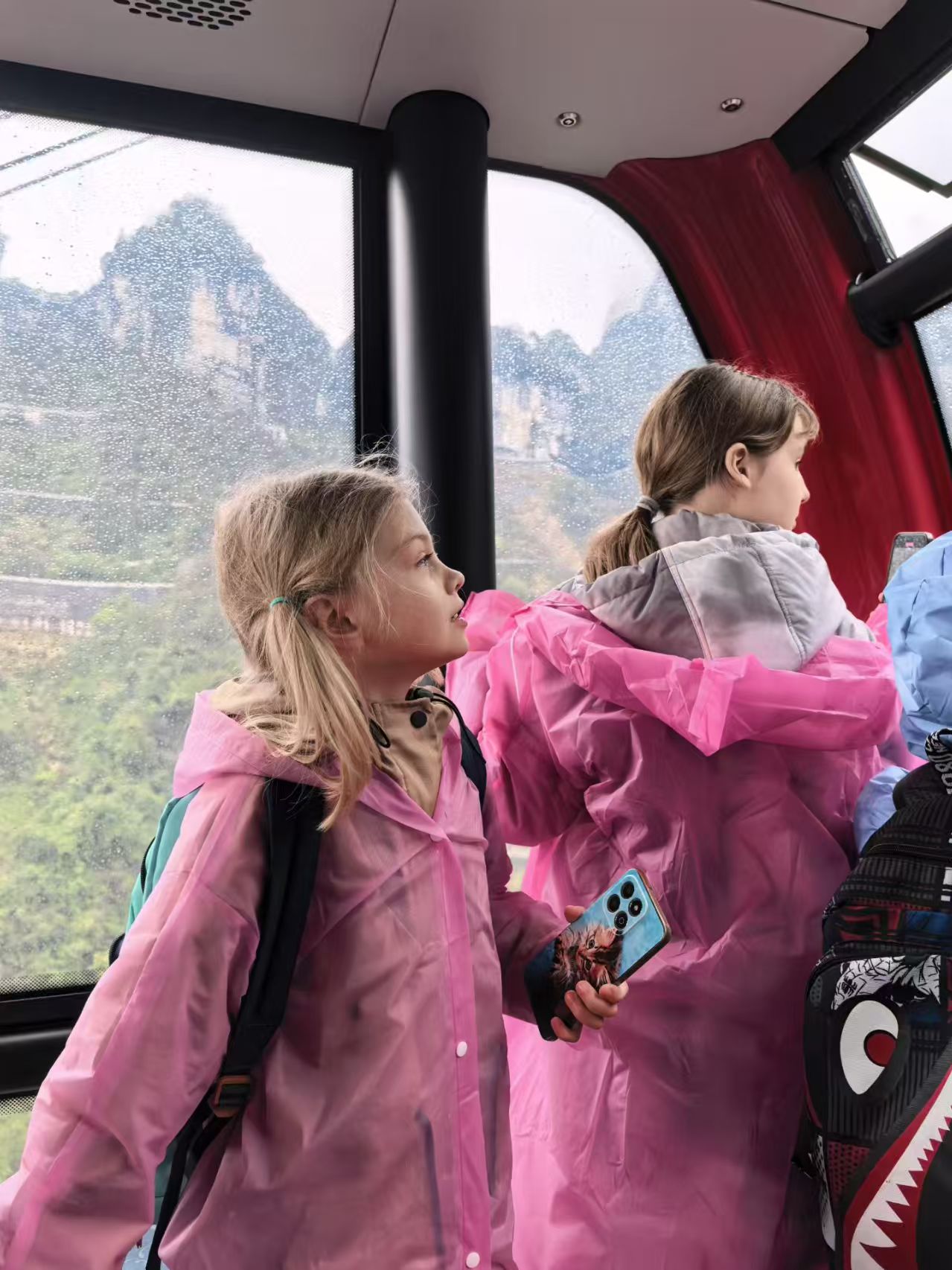 Family inside a Zhangjiajie cable car cabin