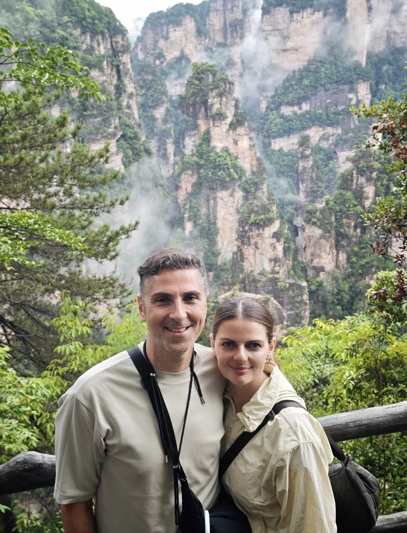 A couple smiling at a Zhangjiajie mountain viewpoint on a private tour