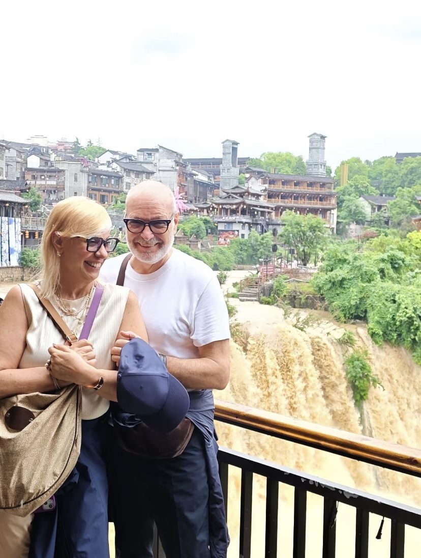 A family at a Zhangjiajie mountain viewpoint on a guided private tour