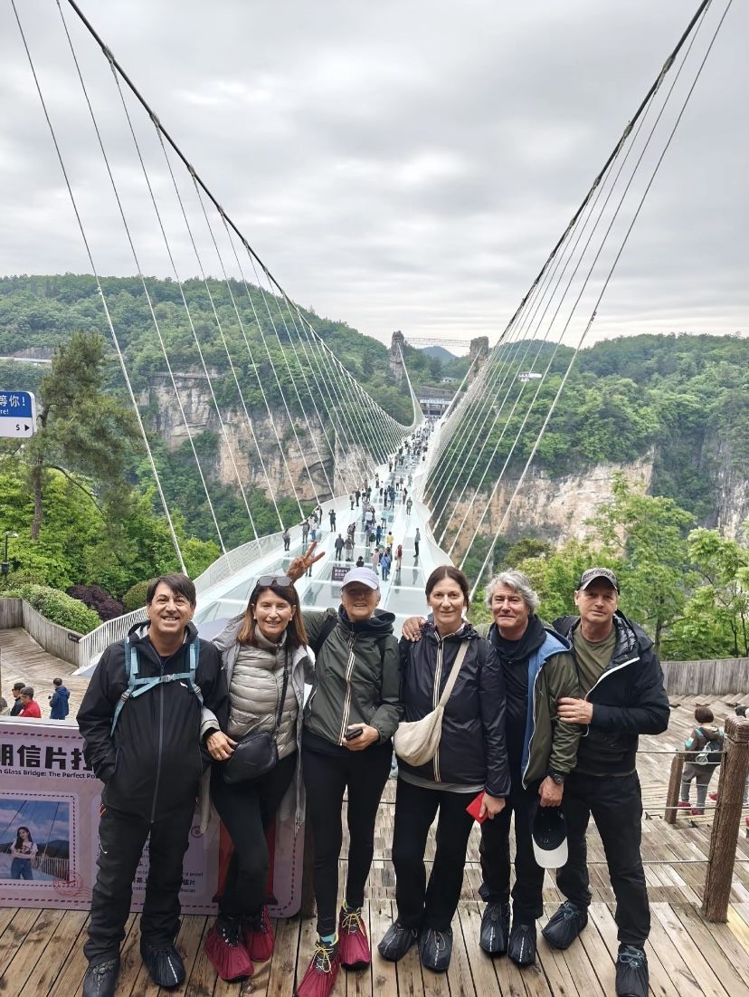 Travelers on the Zhangjiajie Grand Canyon Glass Bridge