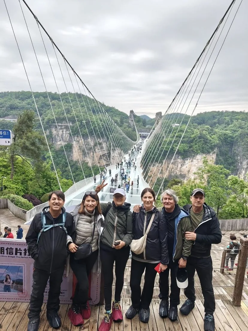 Travelers on the Zhangjiajie Grand Canyon Glass Bridge