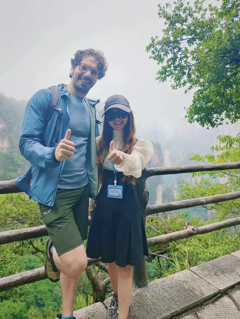 A China Fantasy Travel local guide with a happy guest in Zhangjiajie
